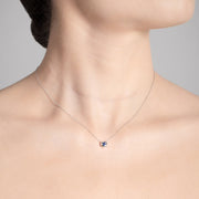 Annie James jewelry blue sapphire and white gold necklace, butterfly charm, thyroid cancer awareness